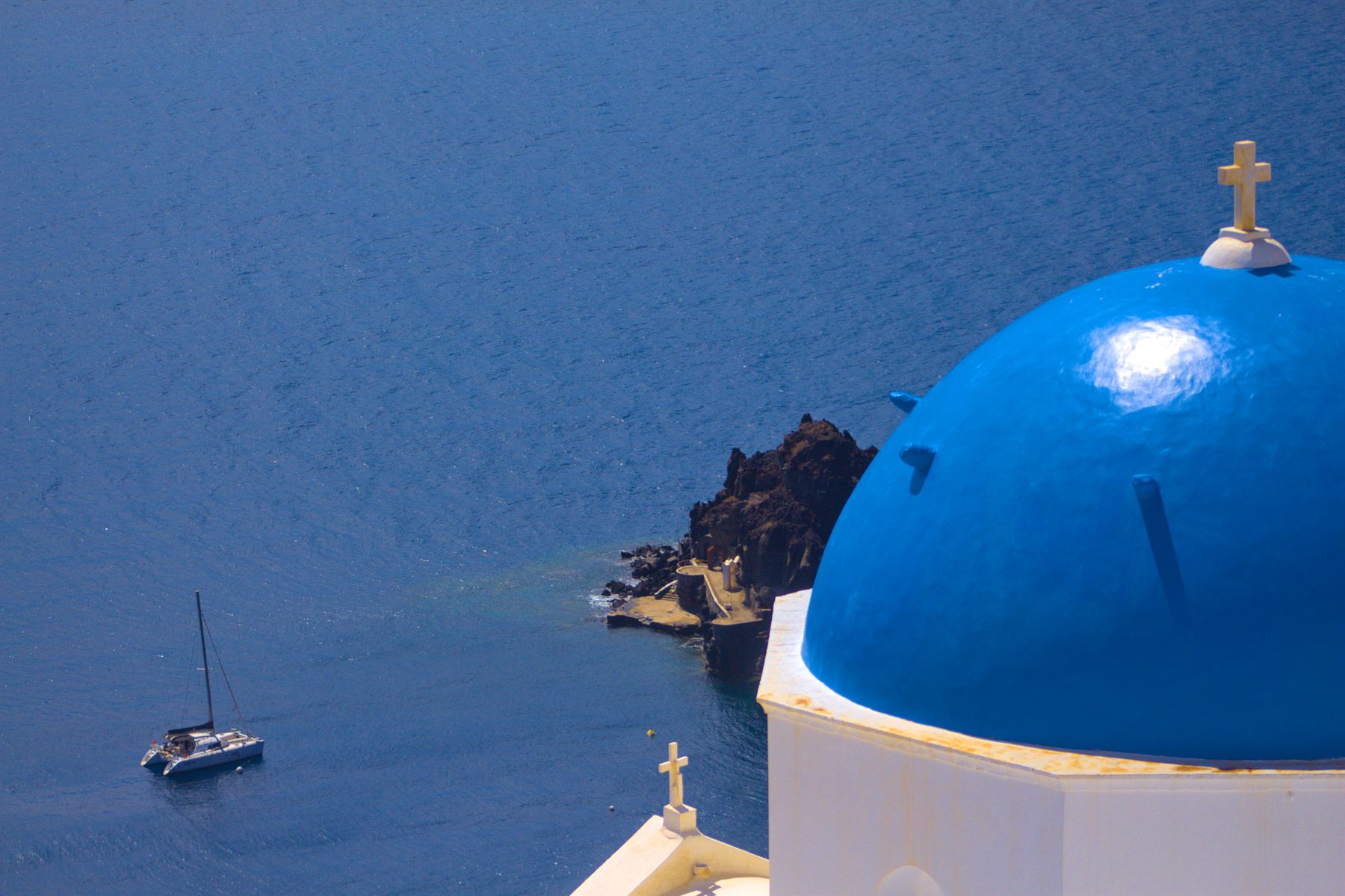 Blue church dome above the caldera, Santorini