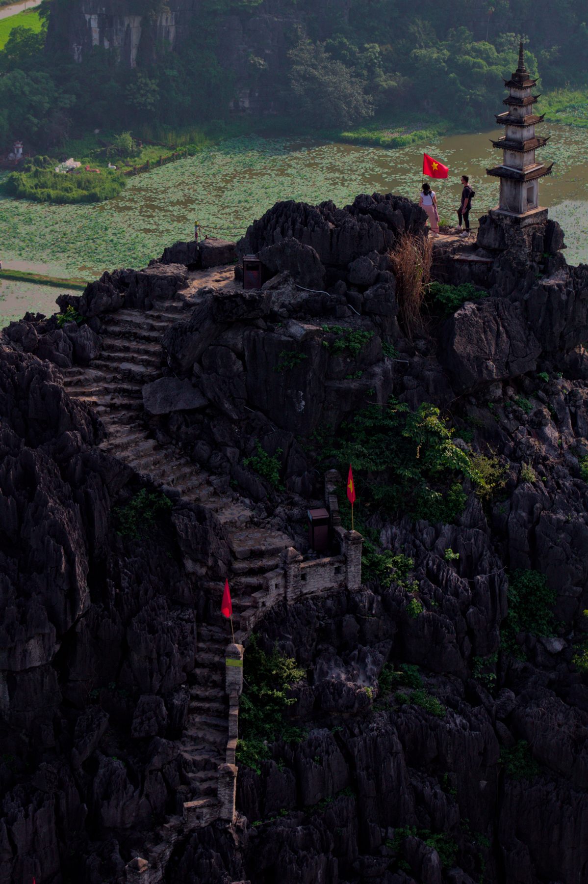 Stone stairs climbing a karst peak to a pagoda, Hang Mua, Ninh Binh
