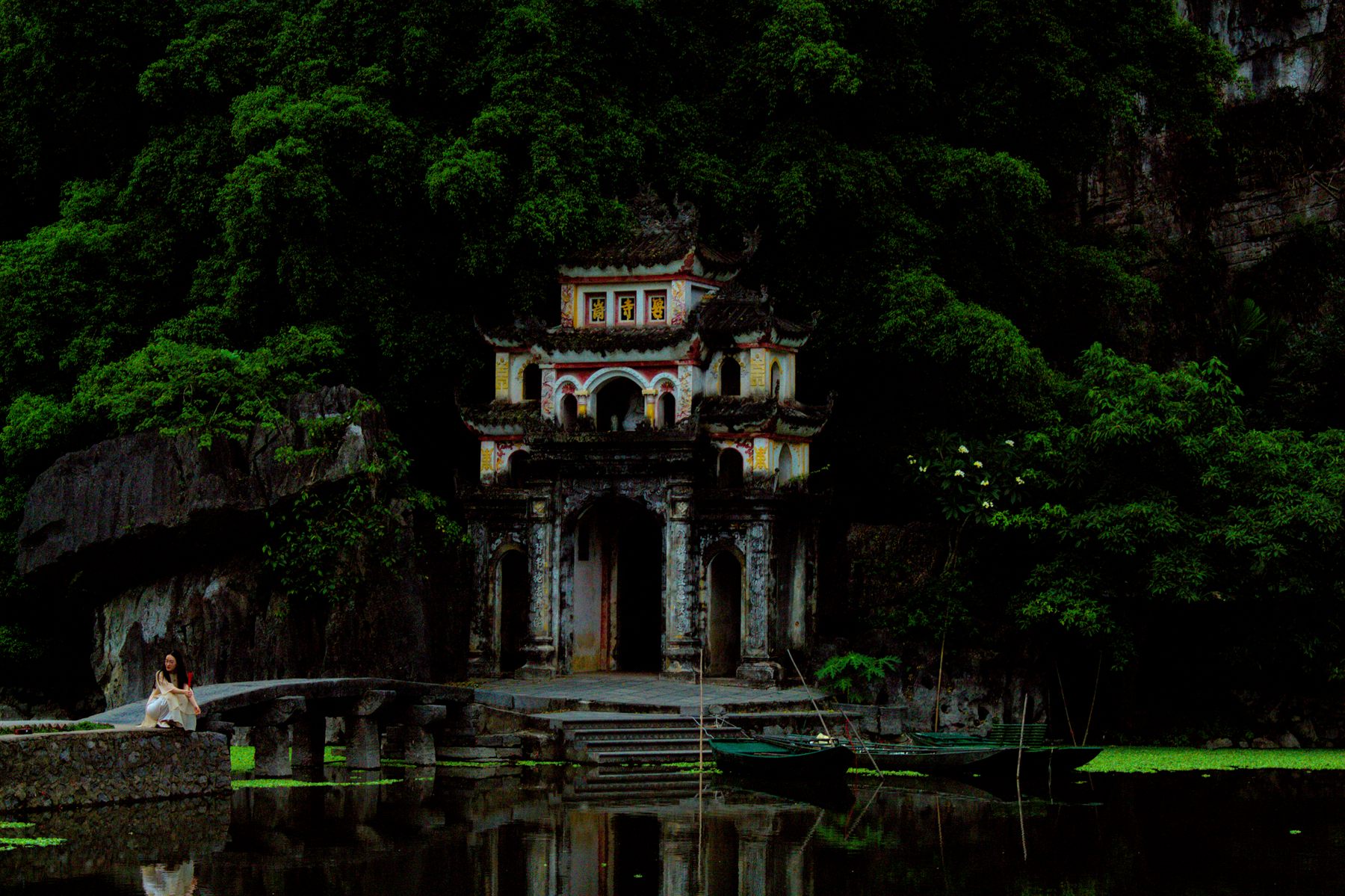 Temple beneath the karst cliffs of Ninh Binh, Vietnam